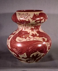 Vase decorated with a design of dragons in ruby red lustre on cream-coloured earthenware, late 19th century